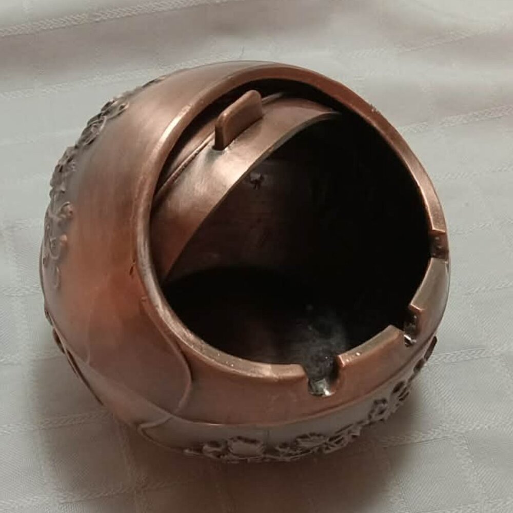 Recent antique-style brass ashtray with embossing for European cigarettes